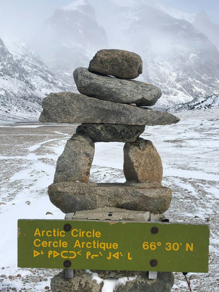 pictured here is an inuksuk, which is a stone sentinel, guiding travelers across the vast Arctic landscape.