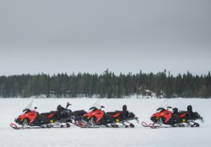 snowmobiles on a frozen lake