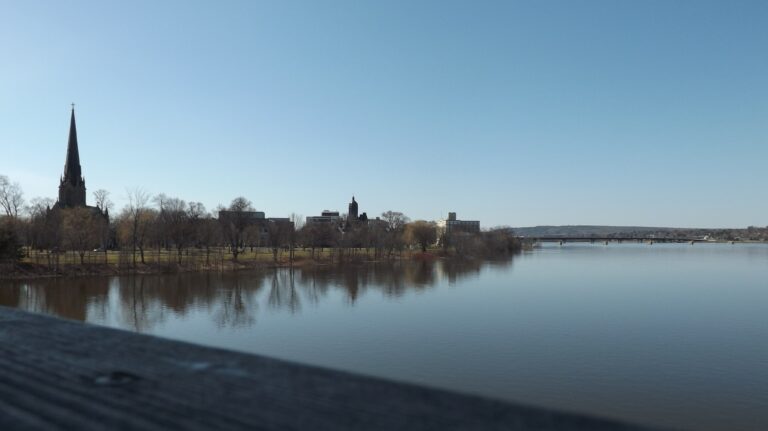 The downtown Fredericton waterfront from the perspective of the Bill Thorpe Walking Bridge