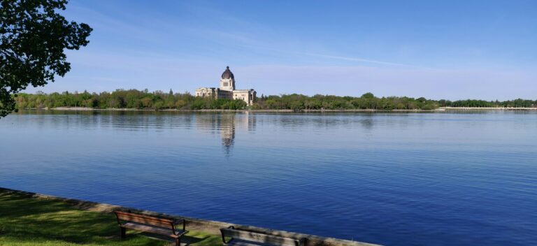 Wascana lake in Regina Saskatchewan showing the legislative building in the background.